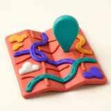 A folded modelling-clay map with rivers, roads and a pin stuck in it.